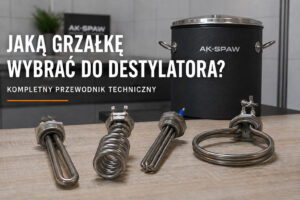Stół z kilkoma modelami grzałek, w tle zbiornik ocieplony matą kauczukową.